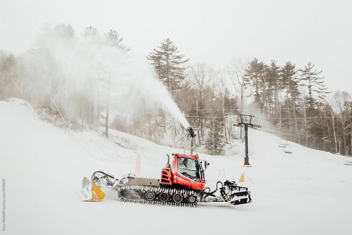 Grooming and snowmaking machines operating at a ski resort in New England