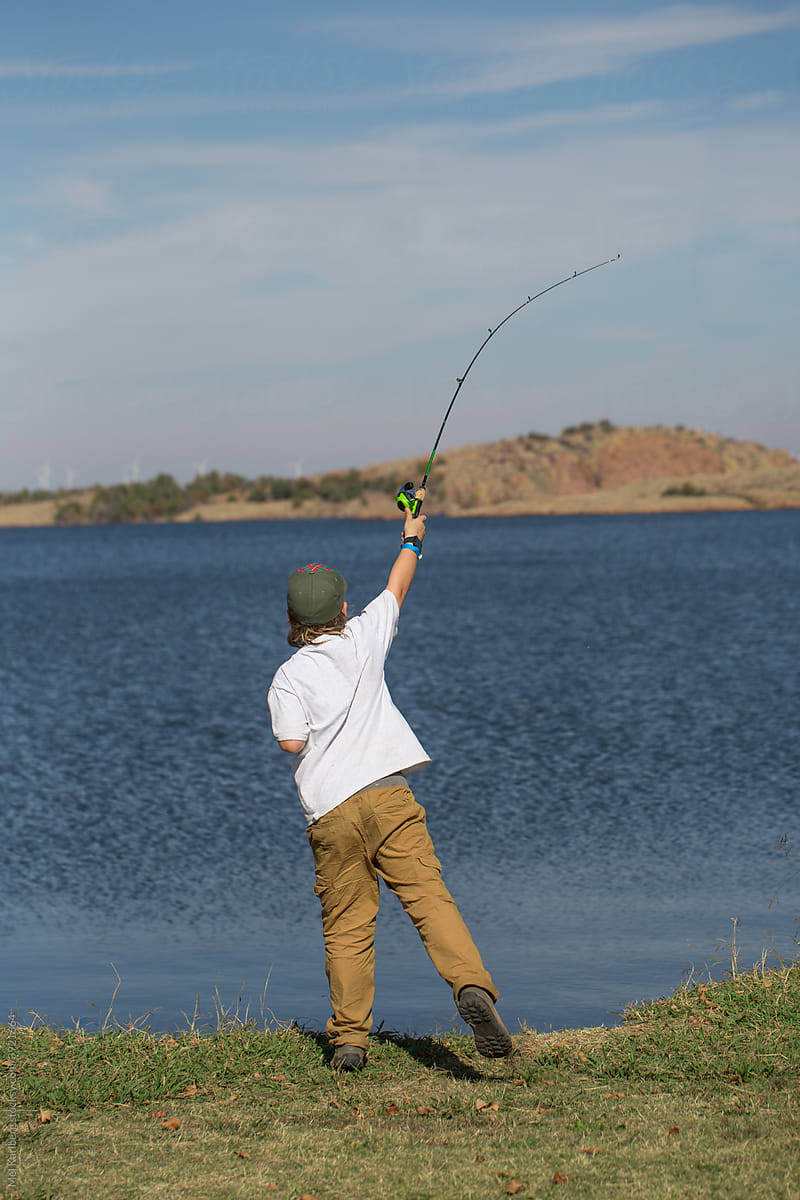 Young boy fishing on a lake