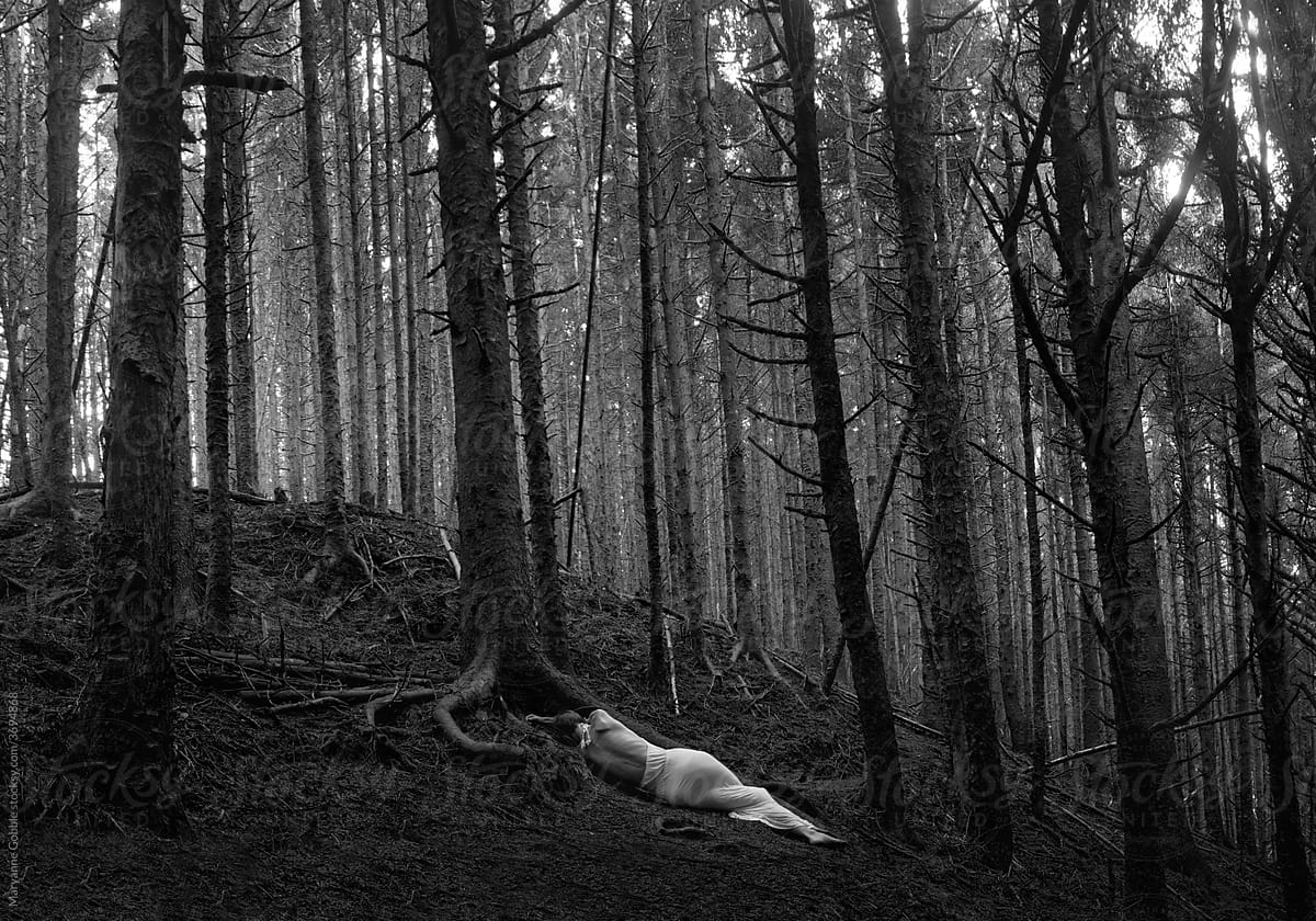 Woman Laying in Forest