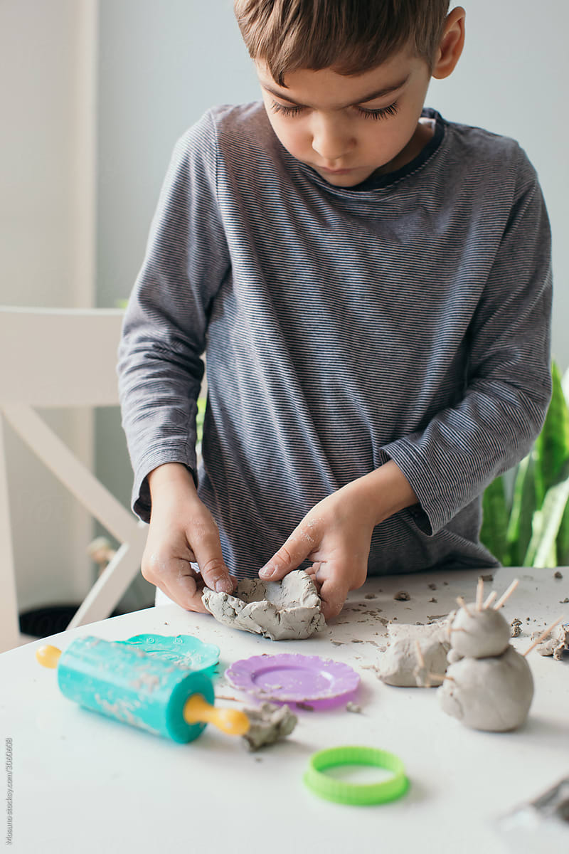Boy Playing with Modeling Clay