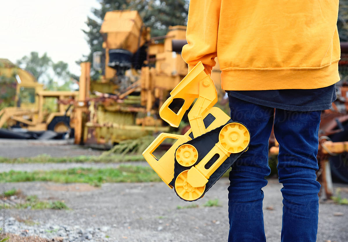 Child Holding Construction Toy