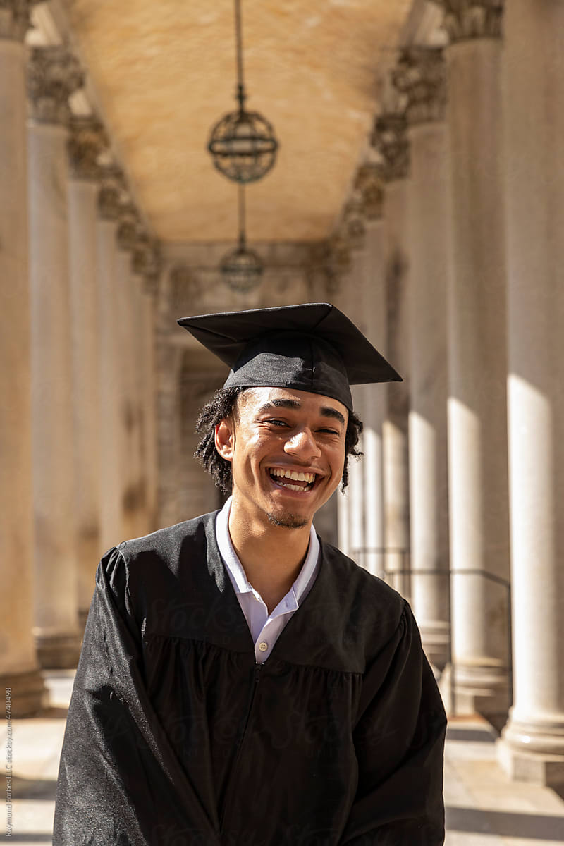 Portrait of Young happy black college graduate with mortarboard