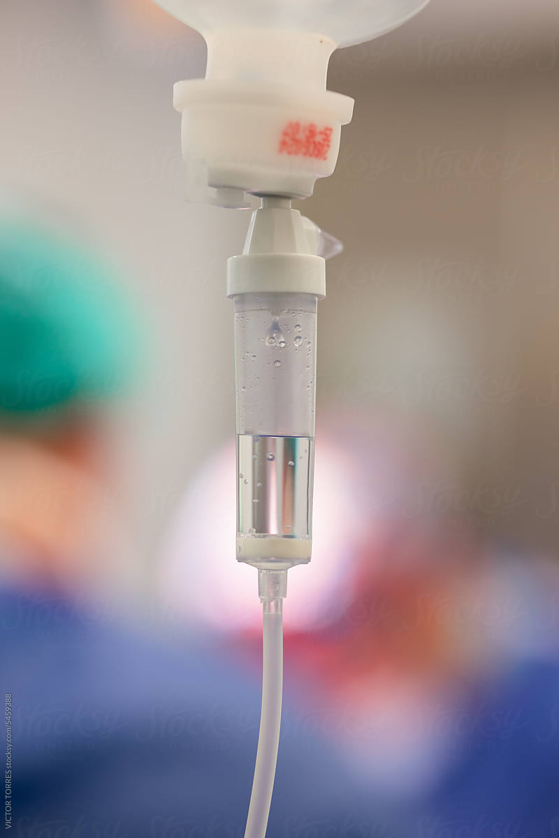 Closeup IV drip chamber in operating room