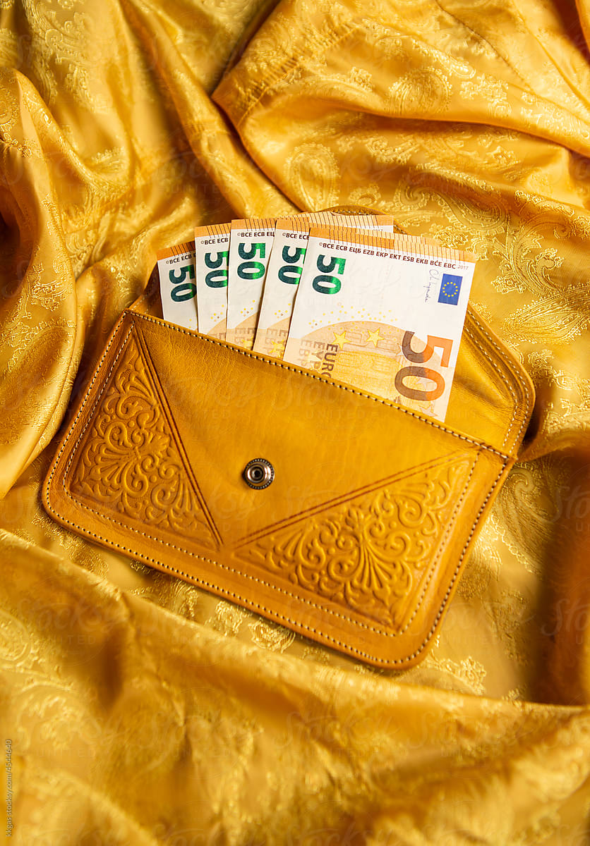 Yellow wallet with euros
