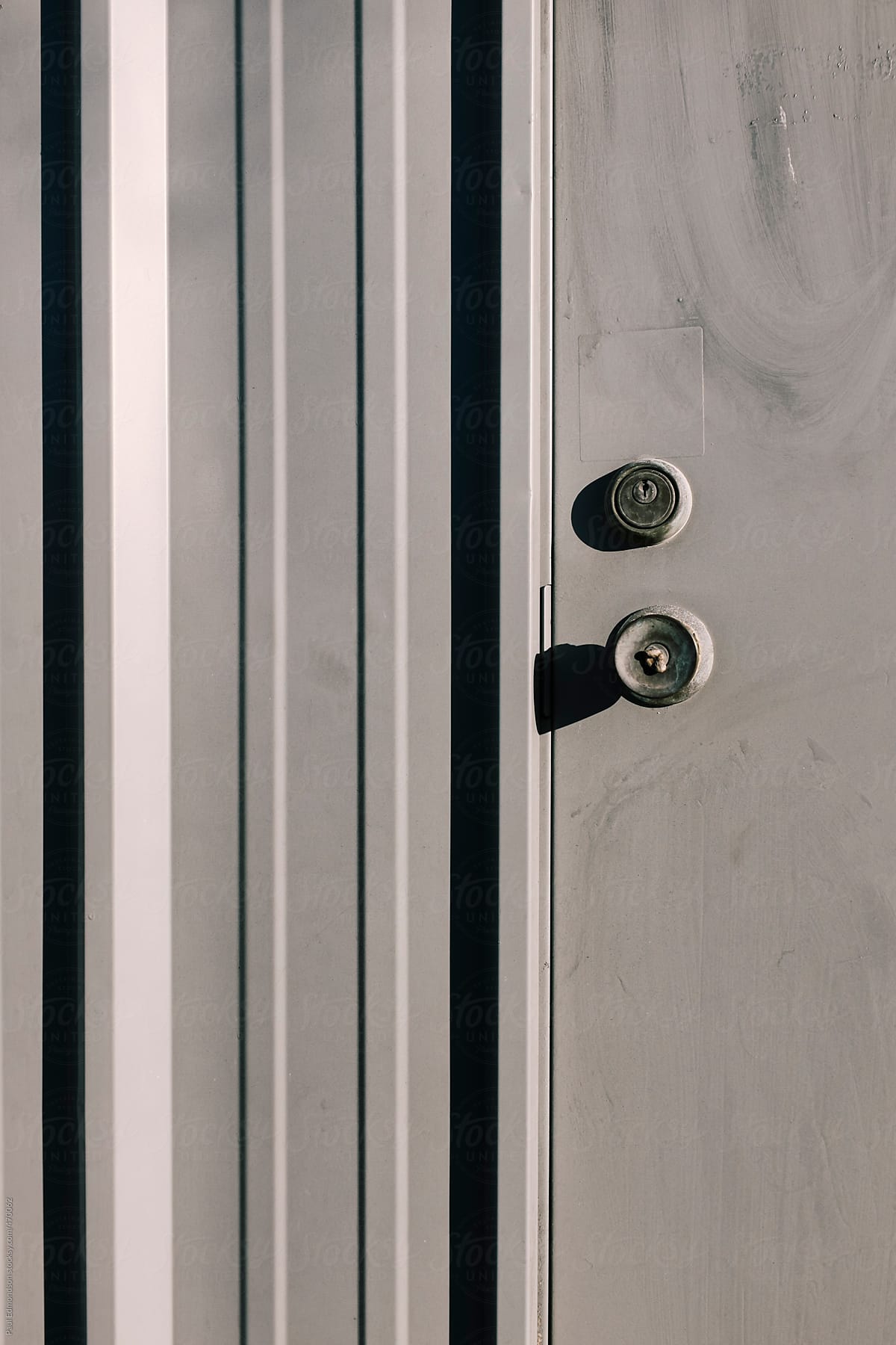 Close up door handle and lock on building exterior