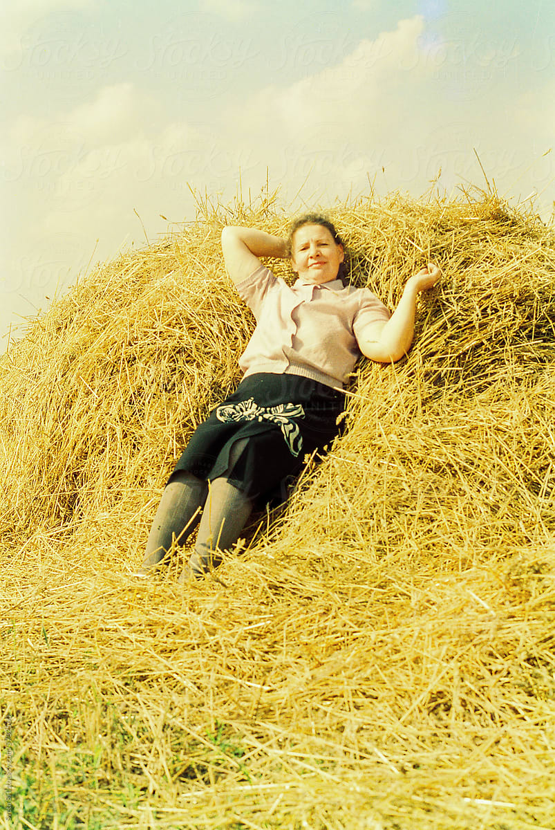 Woman near a haystack