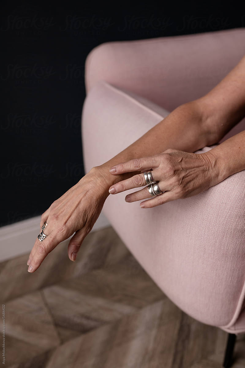 Hands with silver rings on fingers