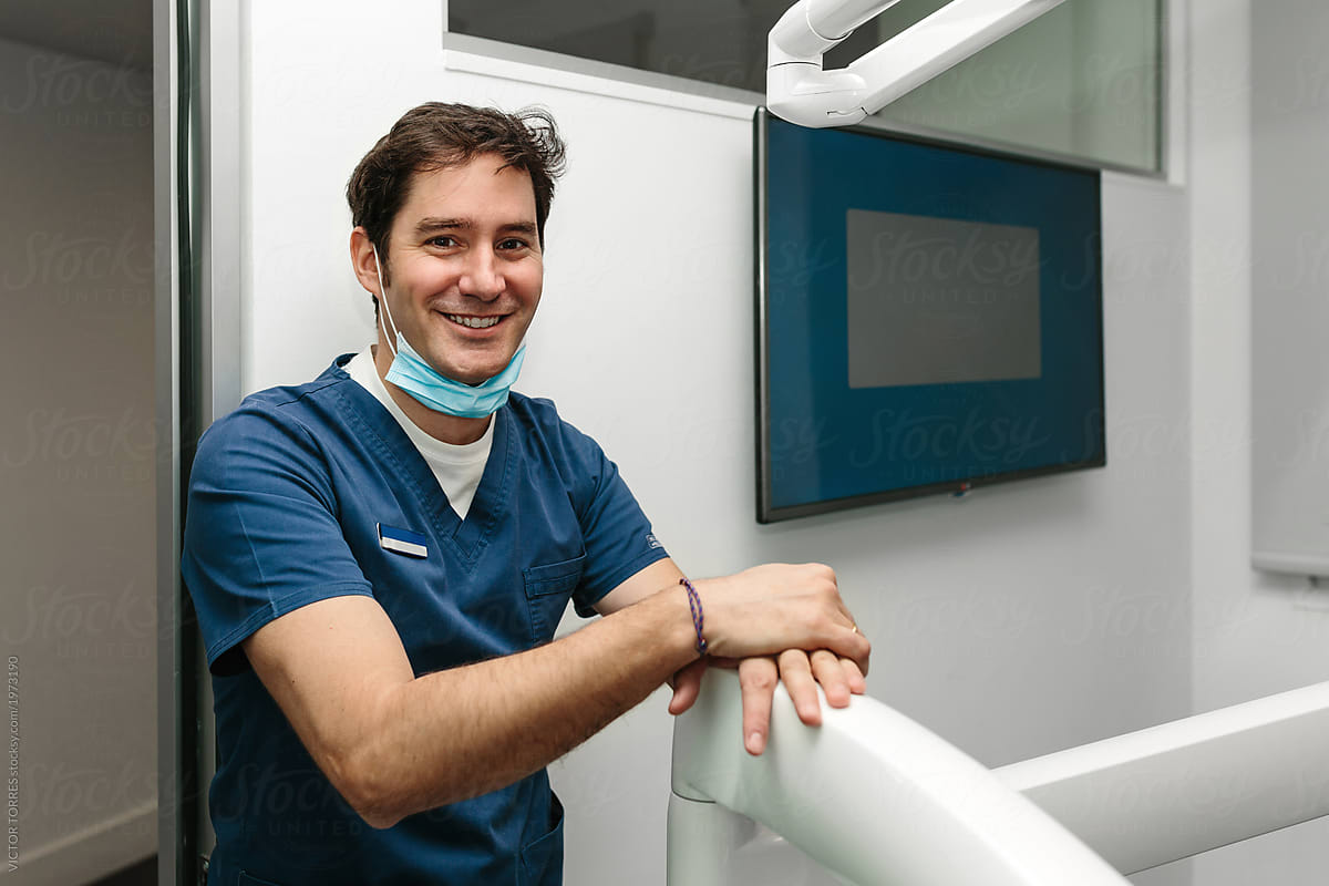 Young smiling doctor looking at camera