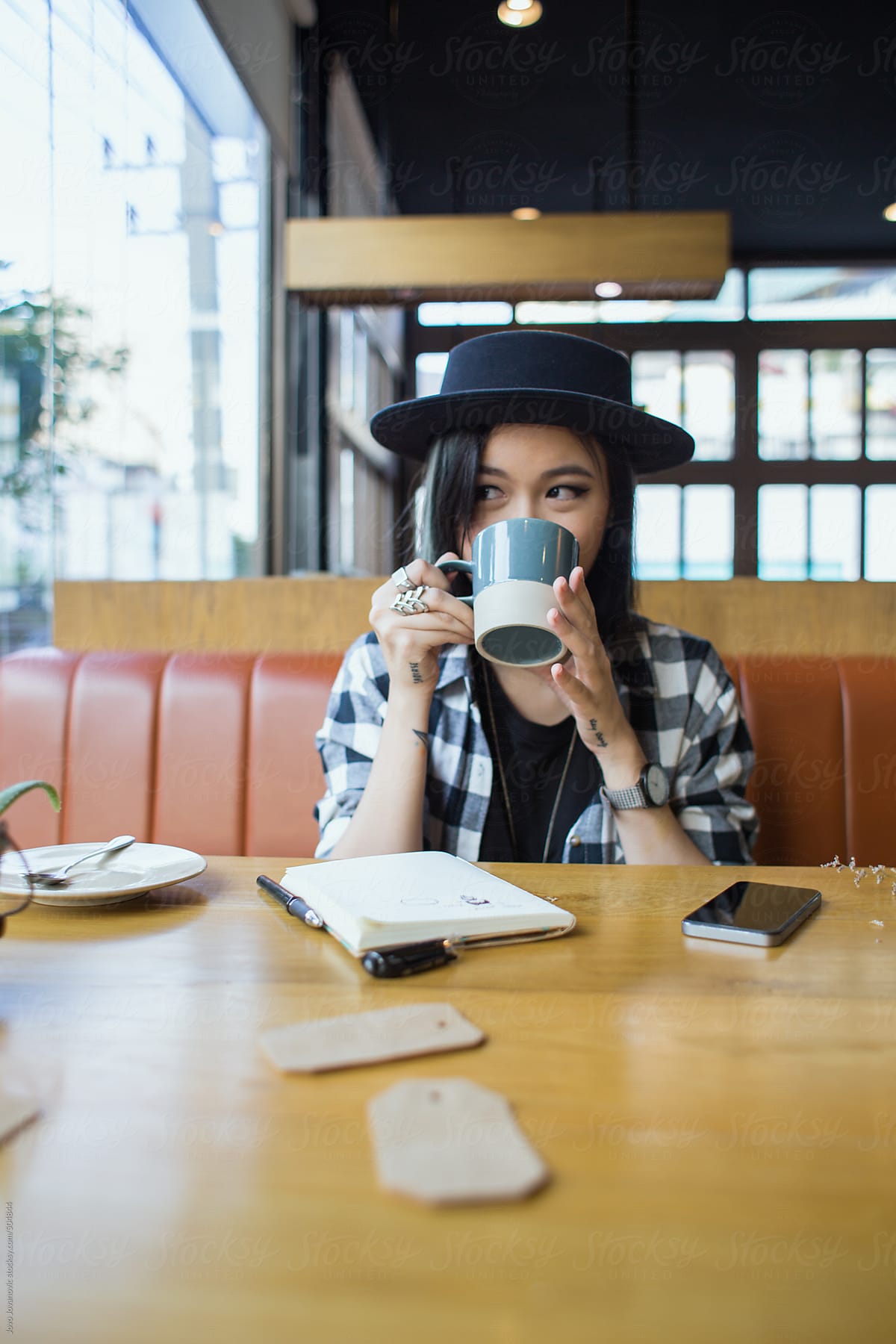 Cute Asian Girl Drinking Coffee Alone In A Coffee Shop By Stocksy Contributor Jovo Jovanovic 