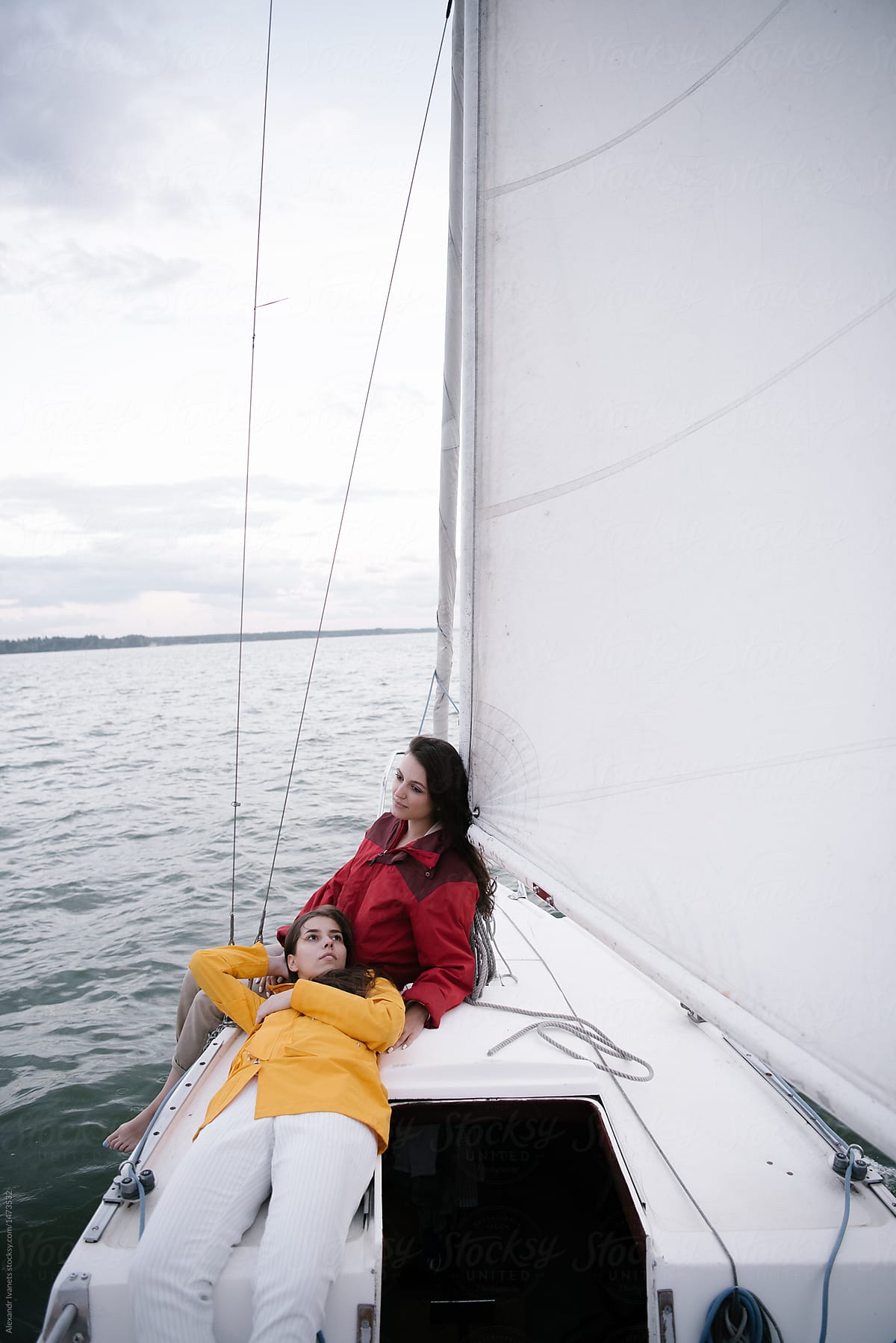 Bonding women posing on sailboat