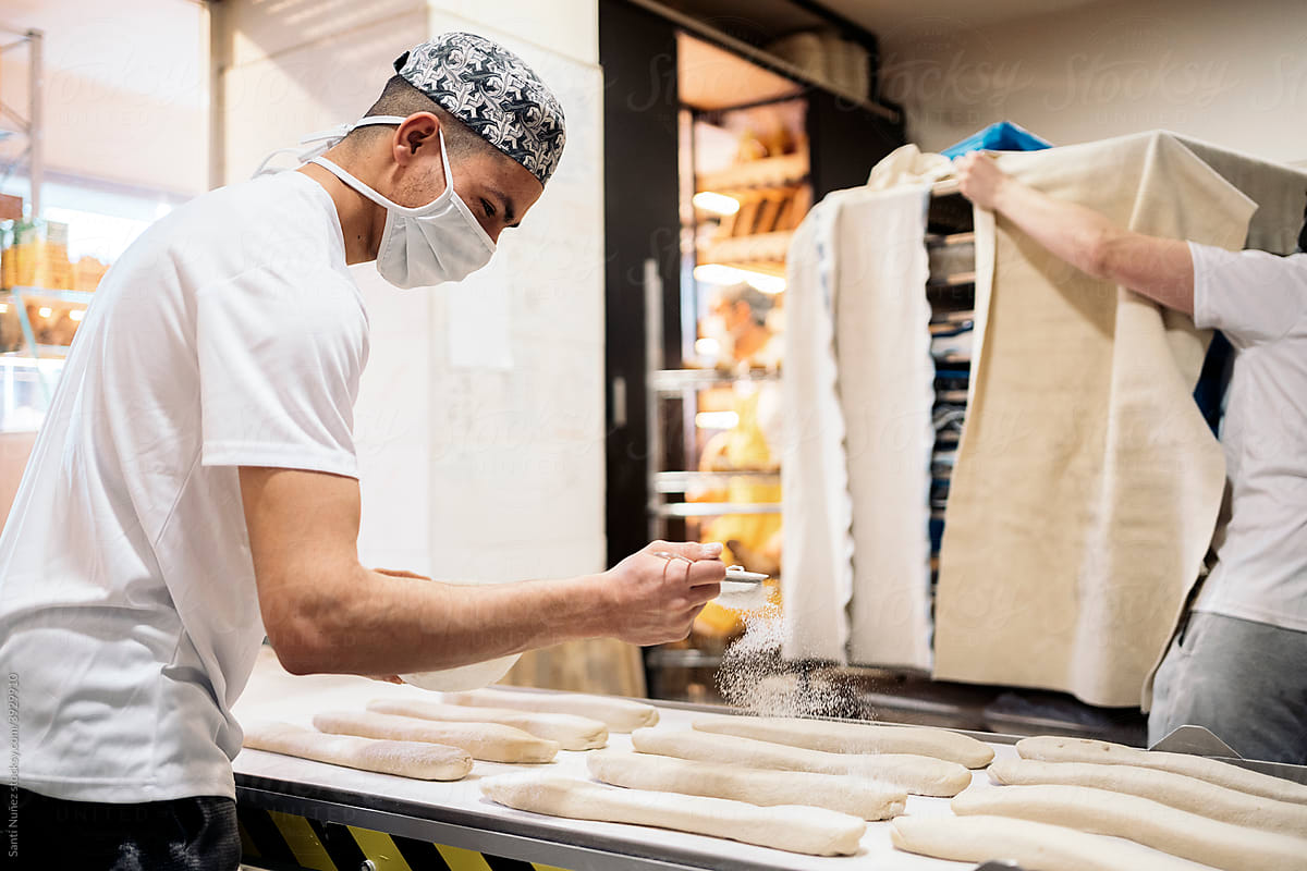 Young Man Working in Bakery Shop