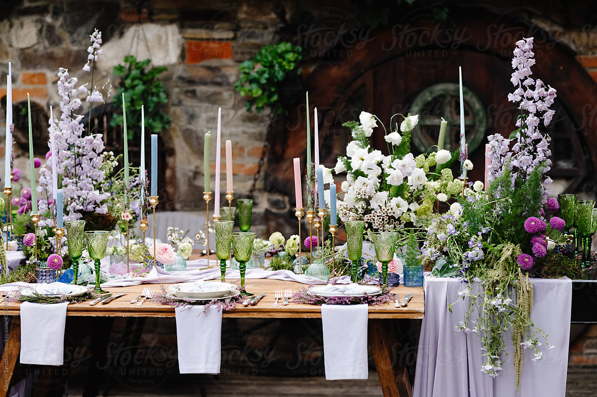 Flower arrangements on wedding desks