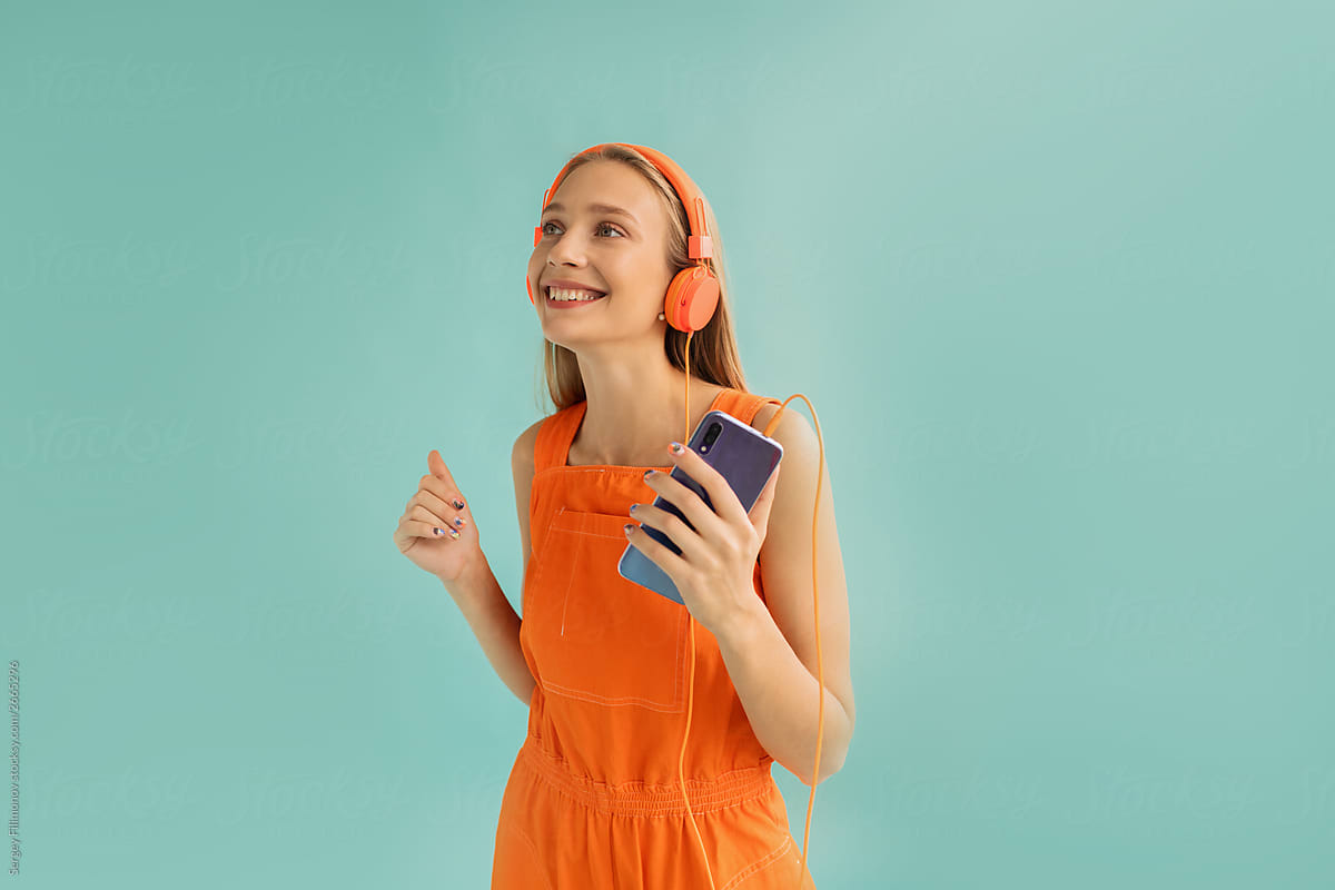 Happy female listening to music