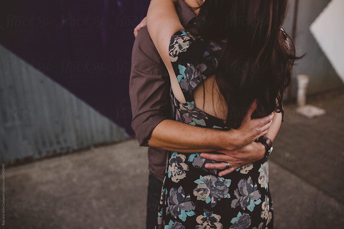 Young Stylish And Romantic Couple Hugging - Guys Arms Holding ...