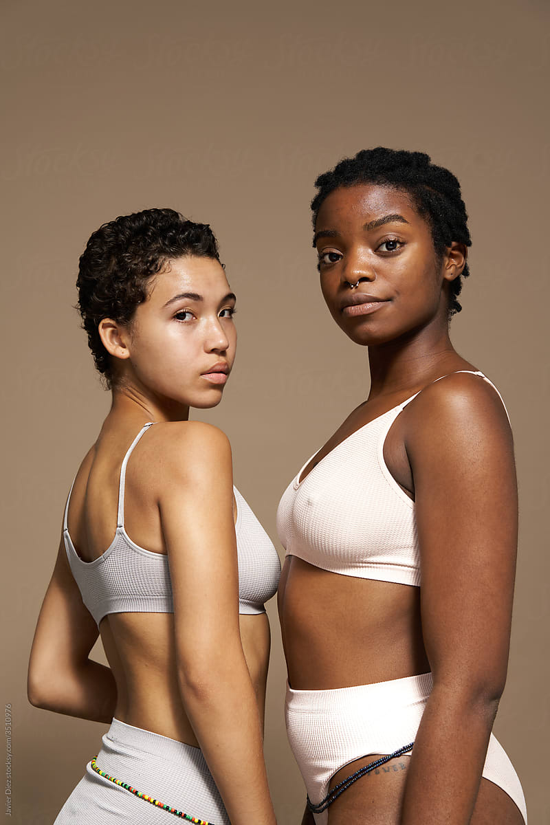 Young women in underwear looking at camera