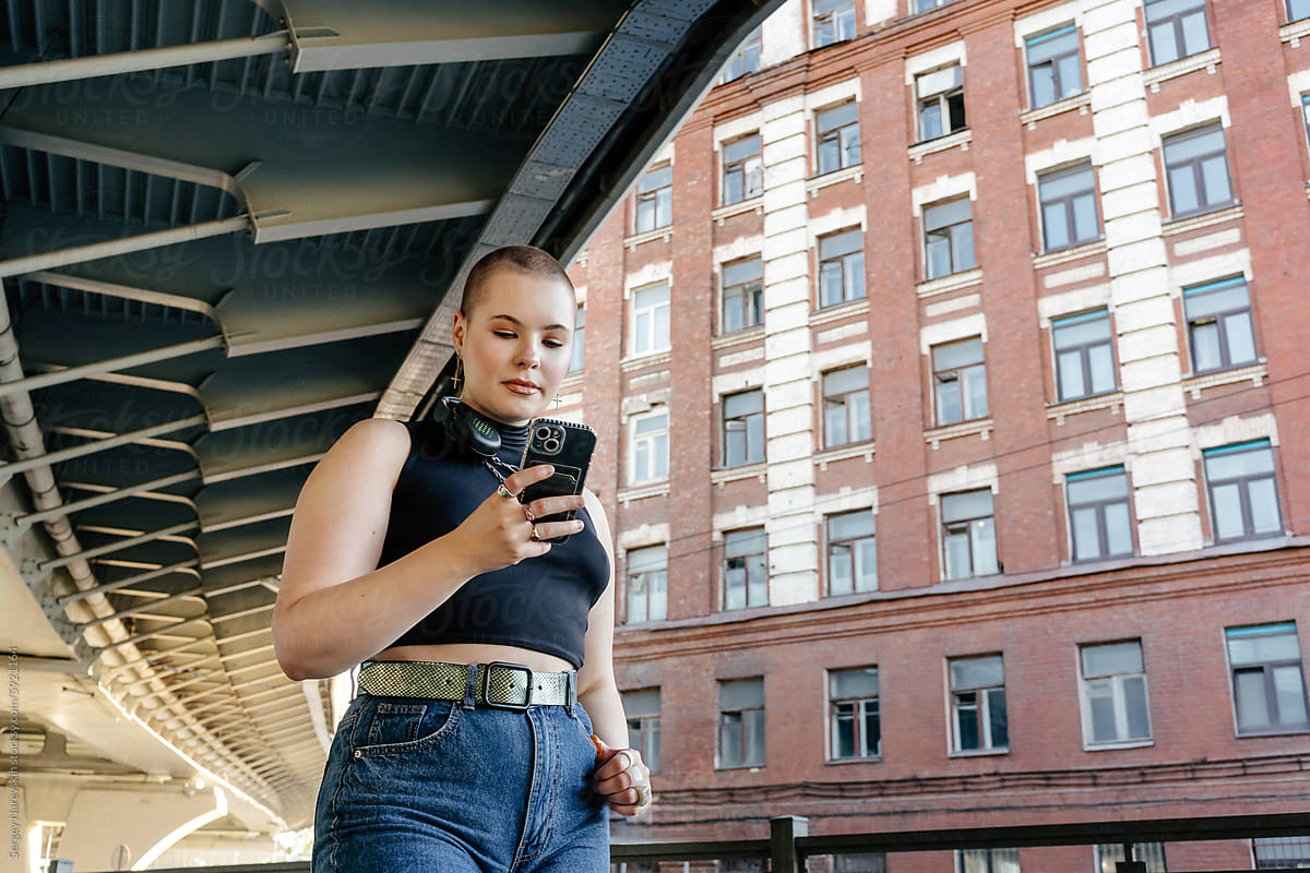 Woman using smartphone, trendy urban lifestyle