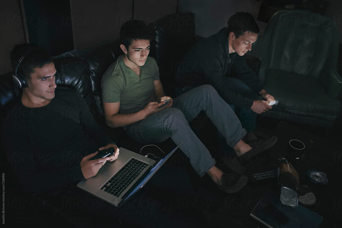 Student Friends and Rommates Playing Video Game and Using Smartphones and Laptop