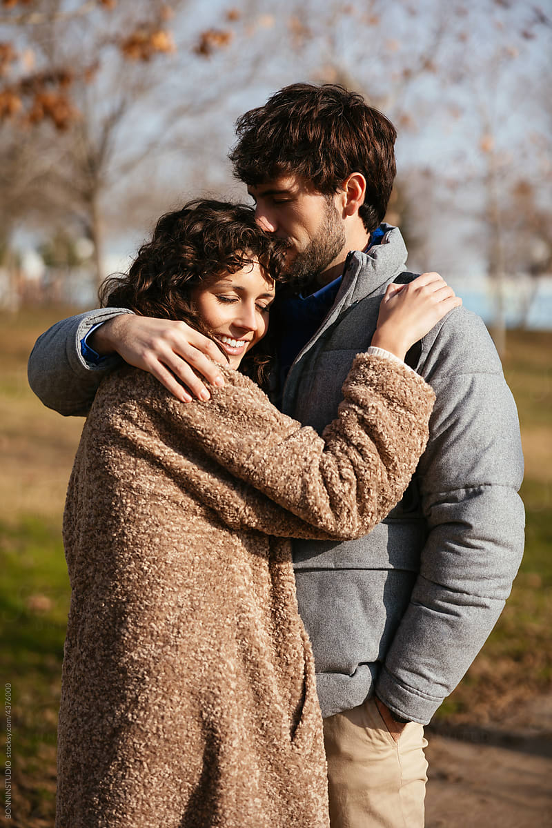 Loving couple hugging in autumn park