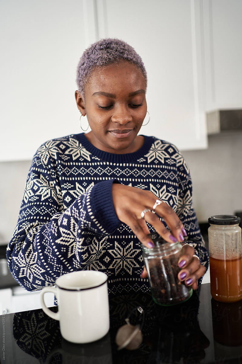 Woman preparing tea at home