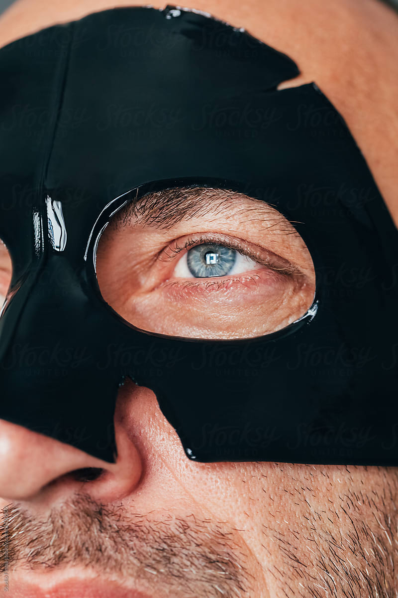 Close up of a Man with Black Facial Mask