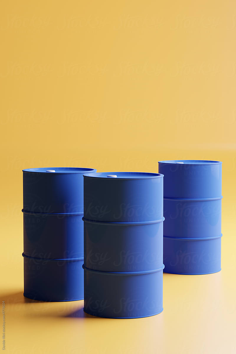 Group of blue oil drums isolated on yellow background