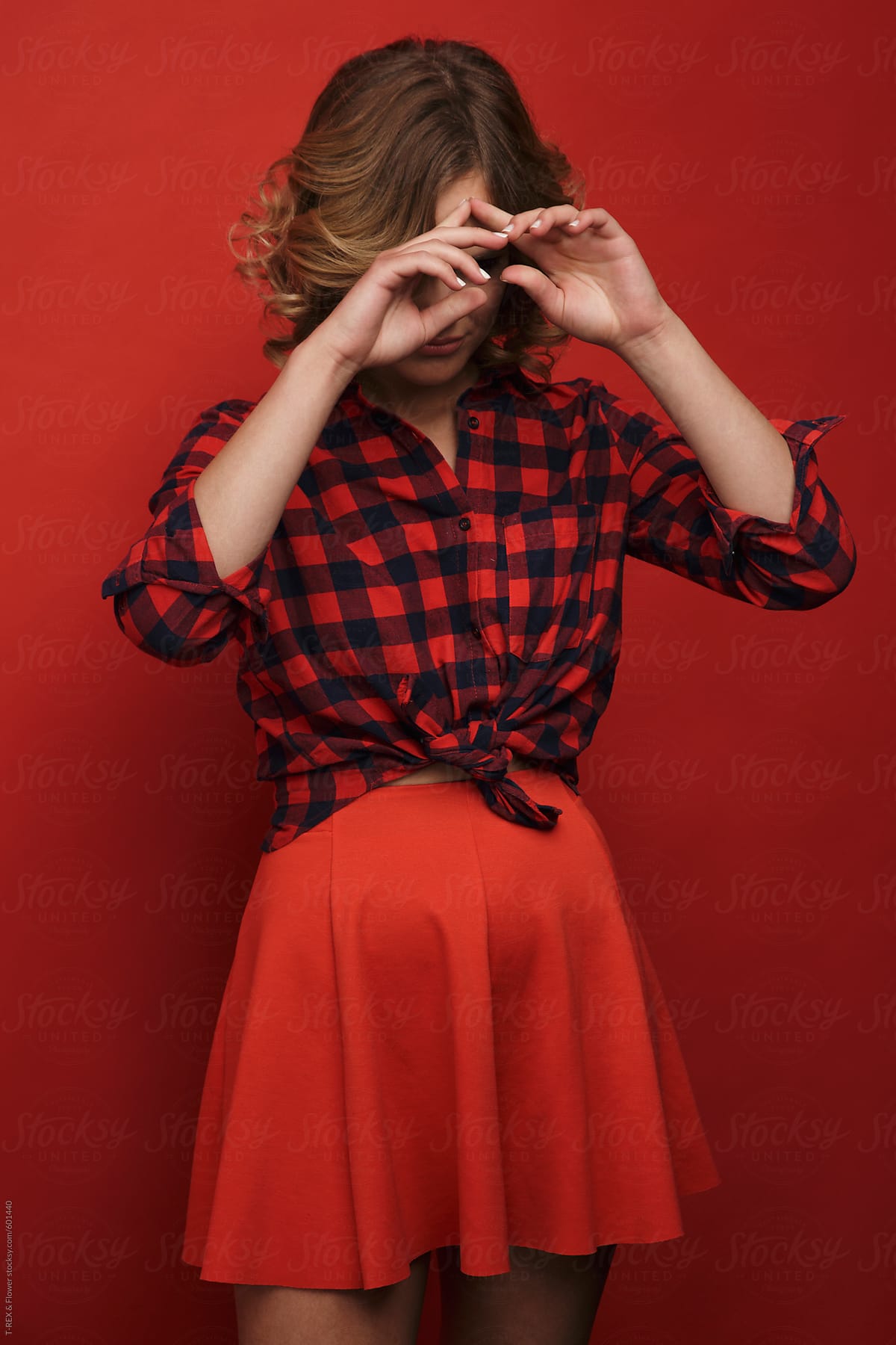 Attractive Young Female In Checkered Shirt And Skirt By Danil Nevsky
