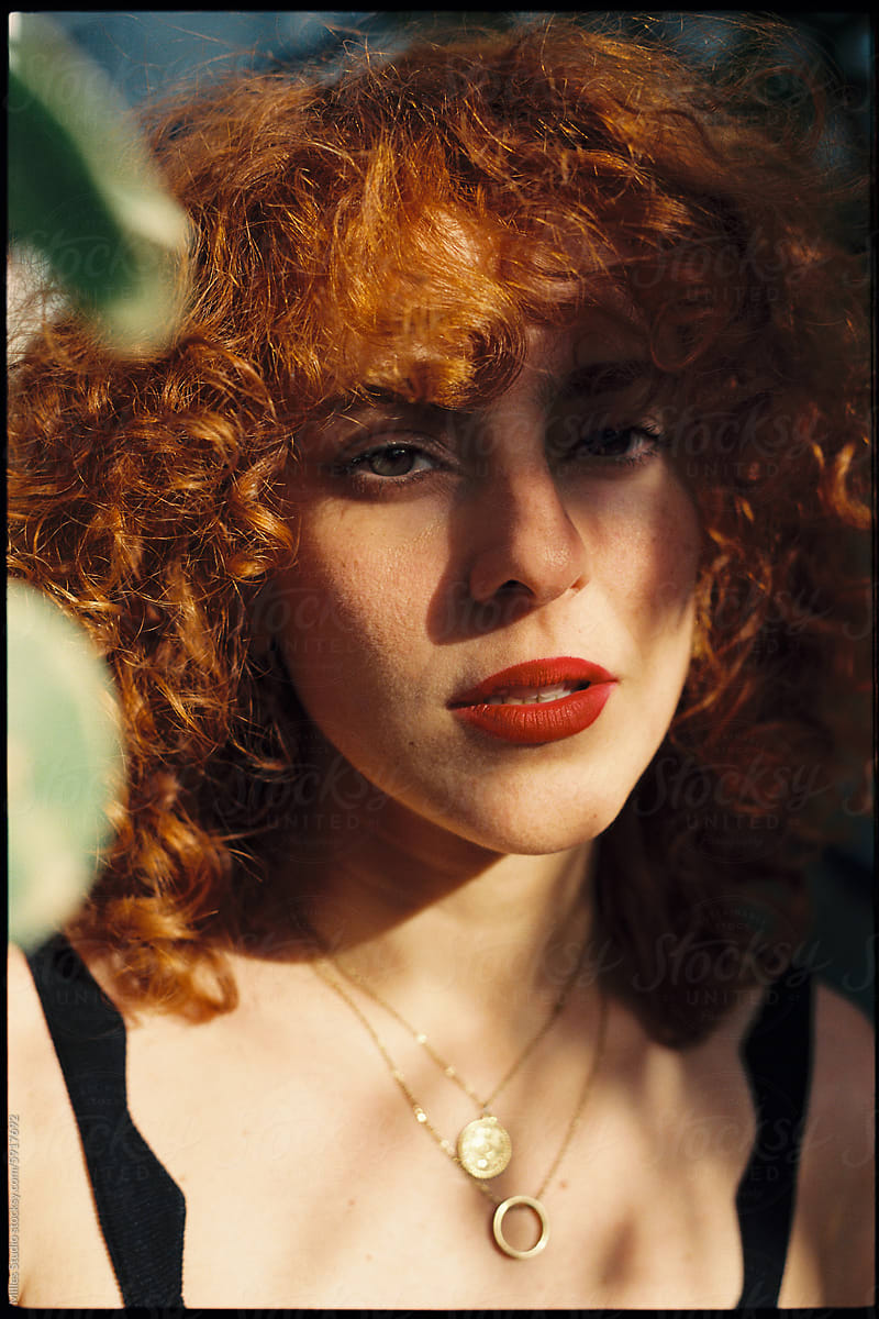 Portrait of young beautiful redhead woman