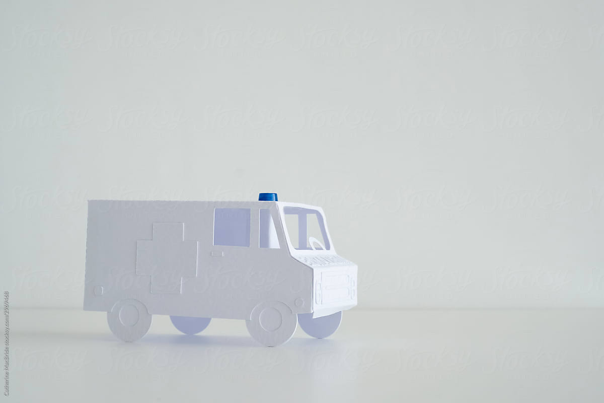 Stock photo of paper craft ambulance with copy space