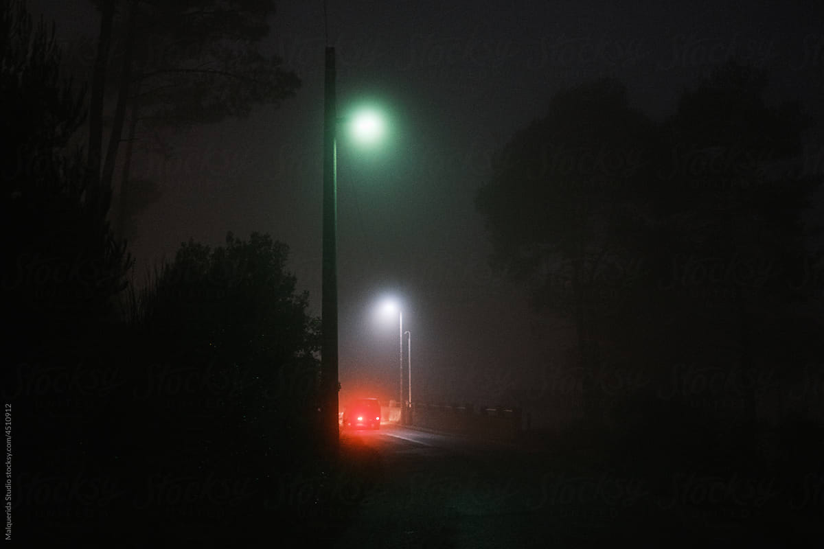 Car on a road a misty night