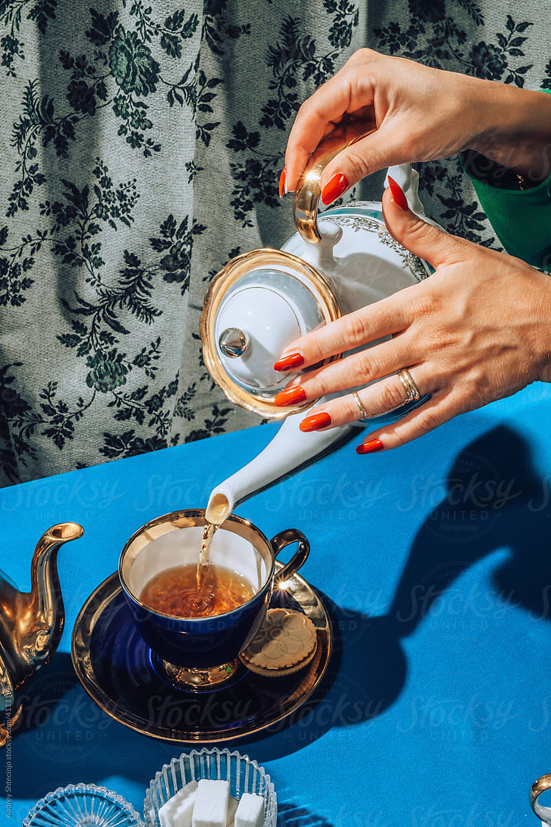 Stylish female hands  at tea time/party