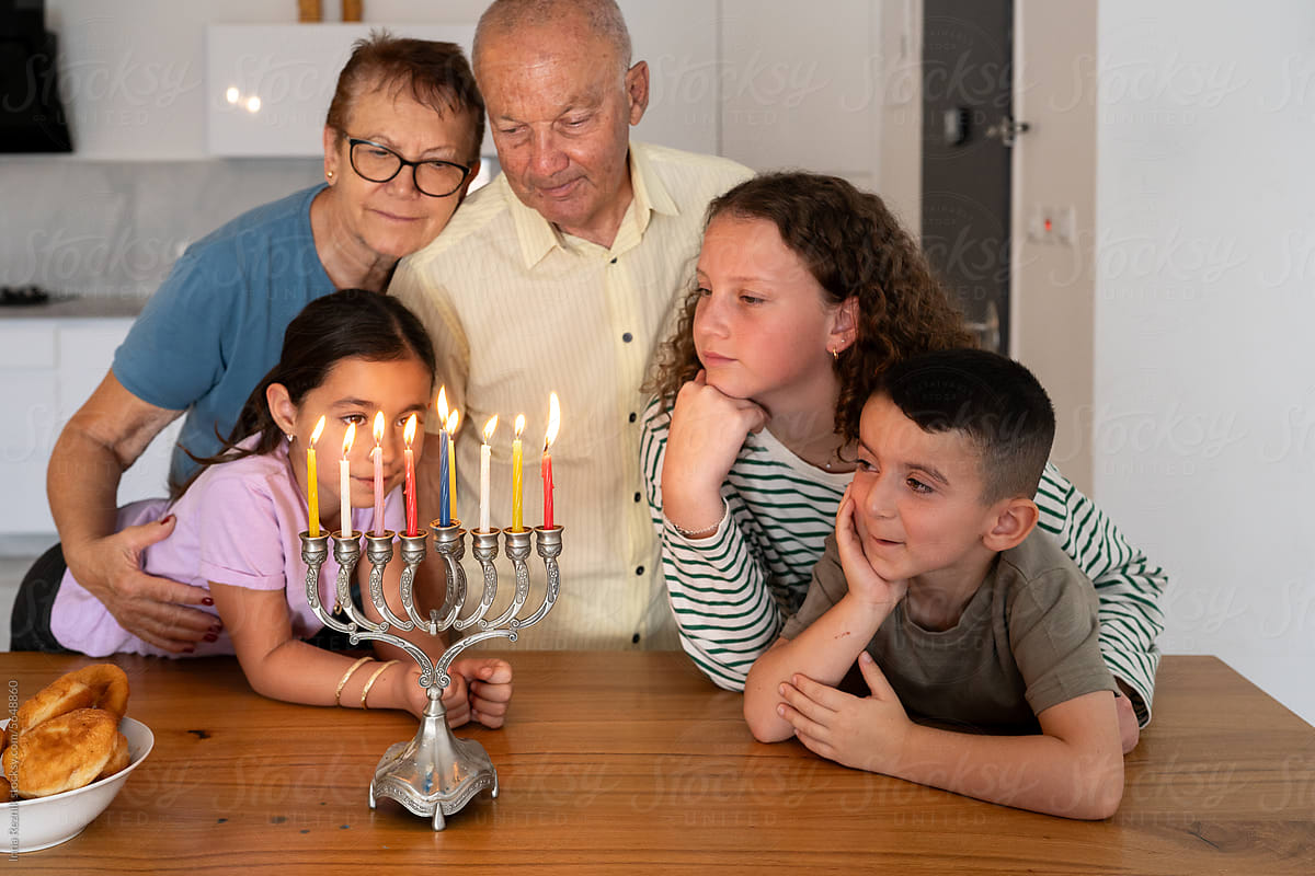Jewish Family Celebrates Hanukkah at Home.