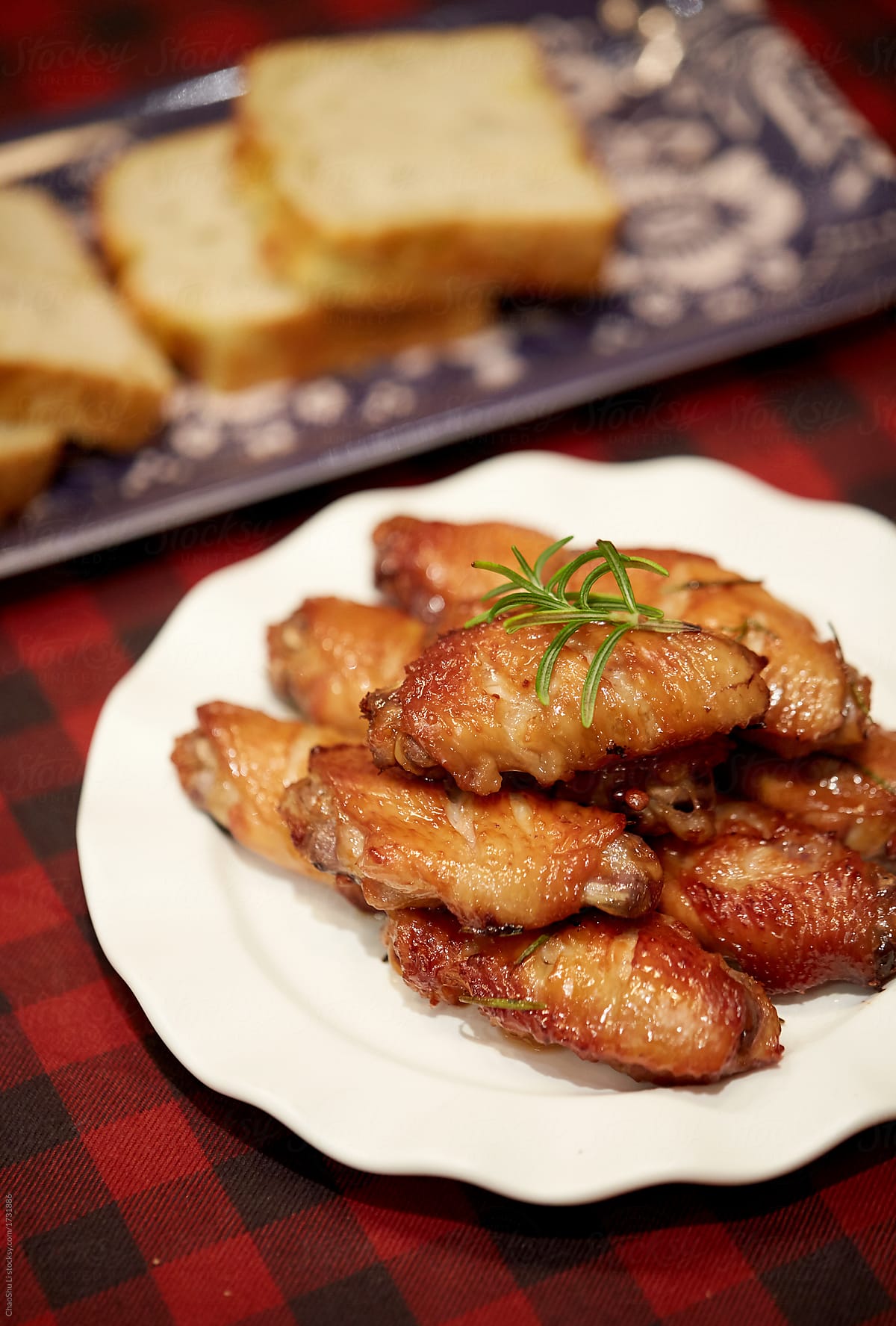 Freshly baked grilled chicken wings on a table in a Christmas atmosphere