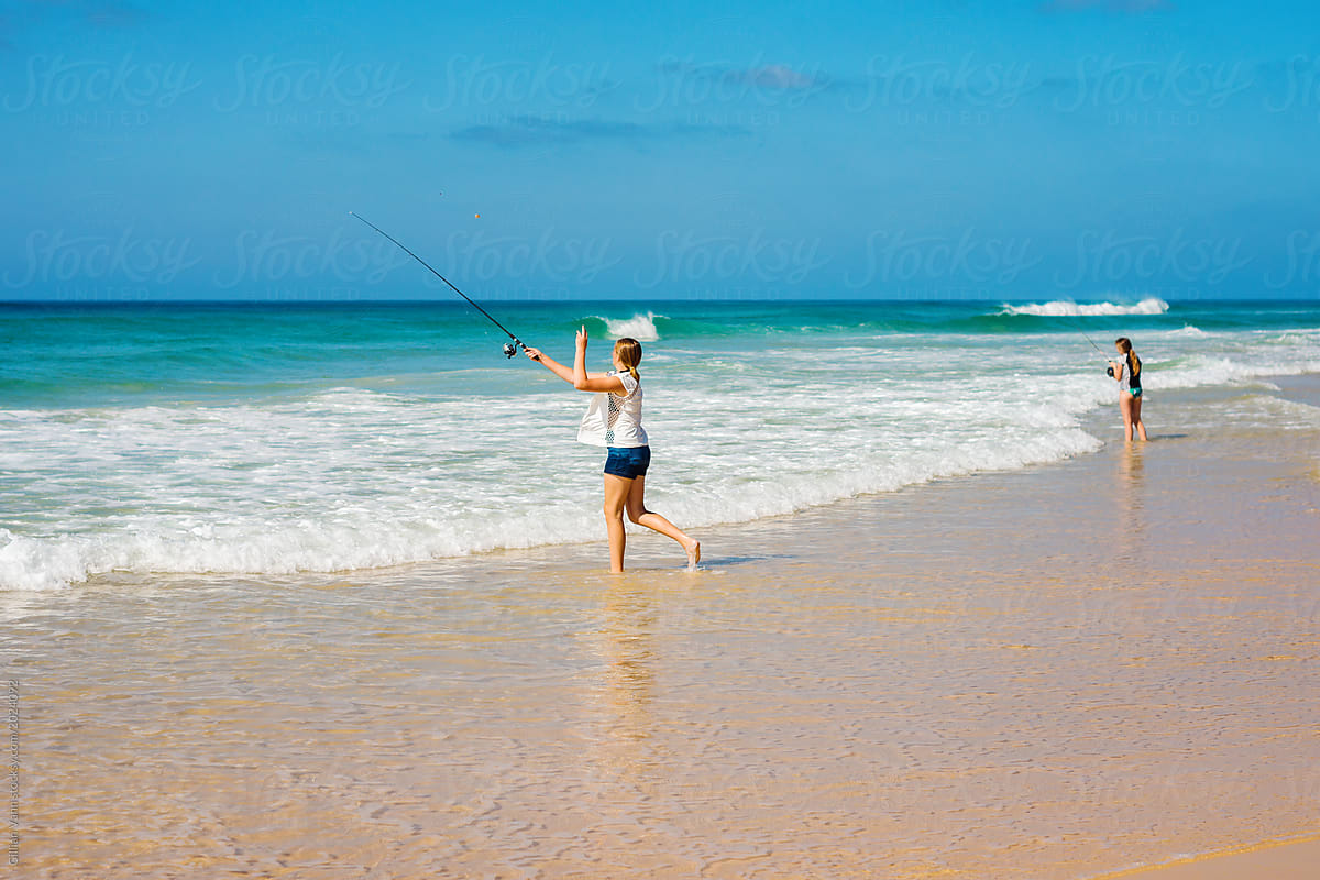 teenager fishing at the beach