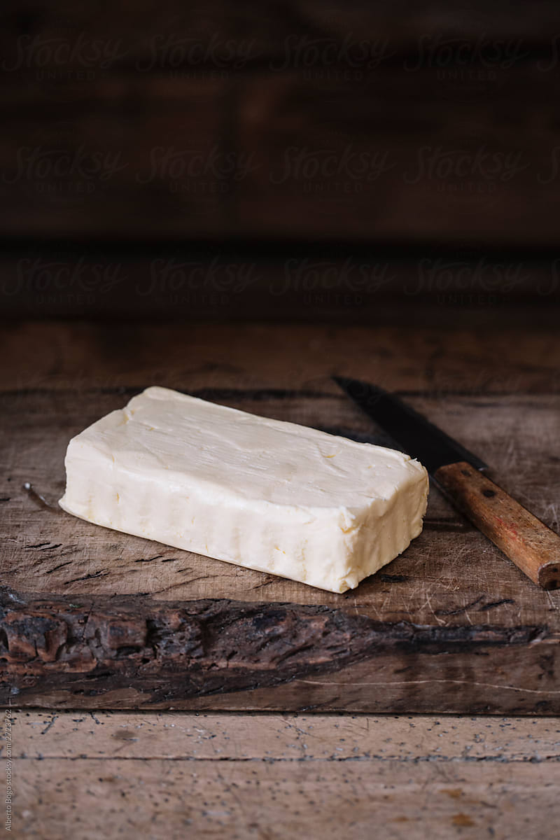 Piece of fresh homemade butter and knife