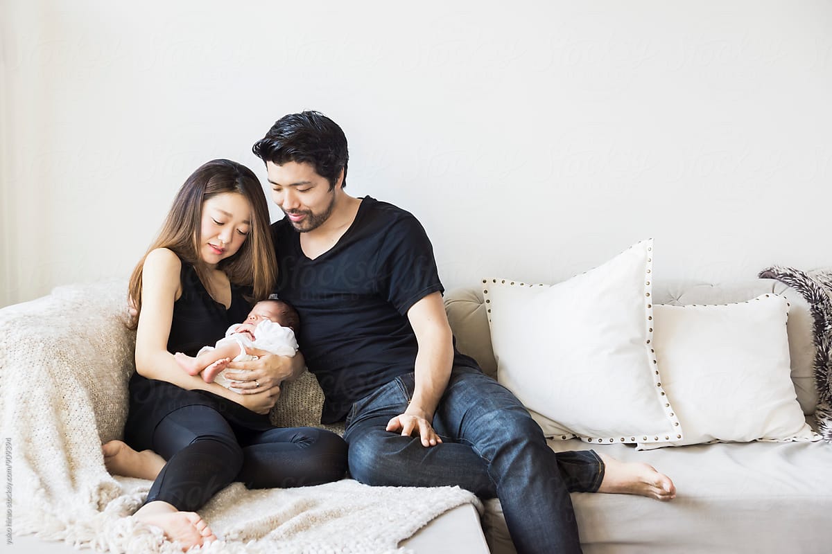 Asian Parents, Holding Newborn Baby At Home by Yuko Hirao