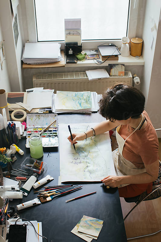Overhead Shot of Young Woman Painter Creating Original Artwork Using Watercolors and Art Pen