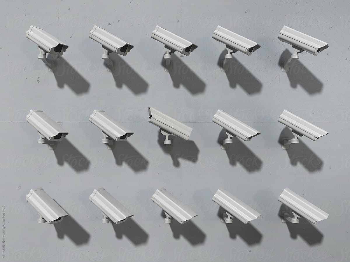Group of cctv cameras pointing at the same direction except one