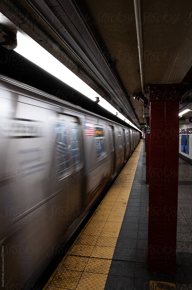 Speeding subway train in Manhattan station