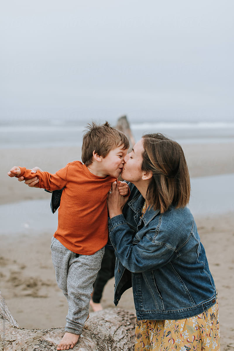 Mother Kissing Young Son By Stocksy Contributor Leah Flores Stocksy