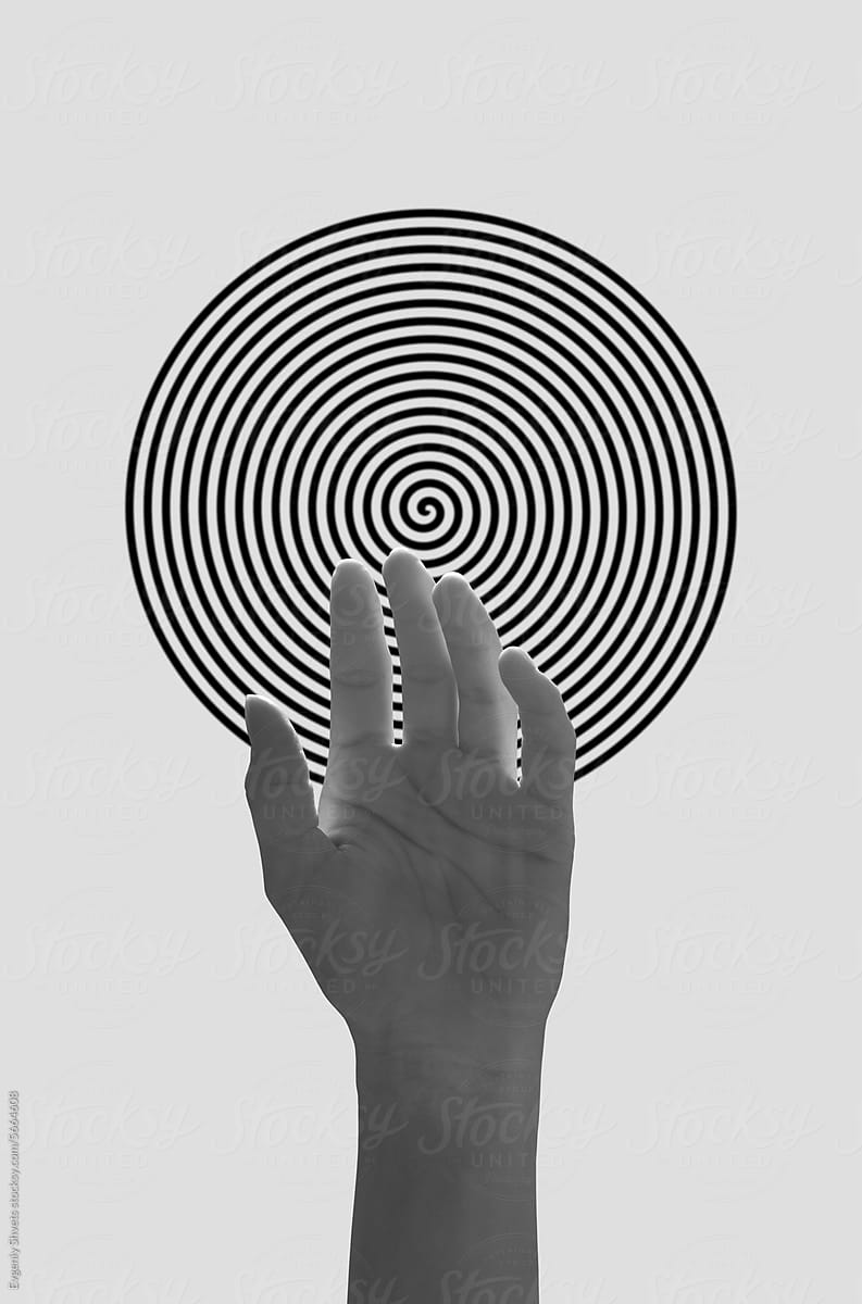 Hand of a woman against hypnotic spiral