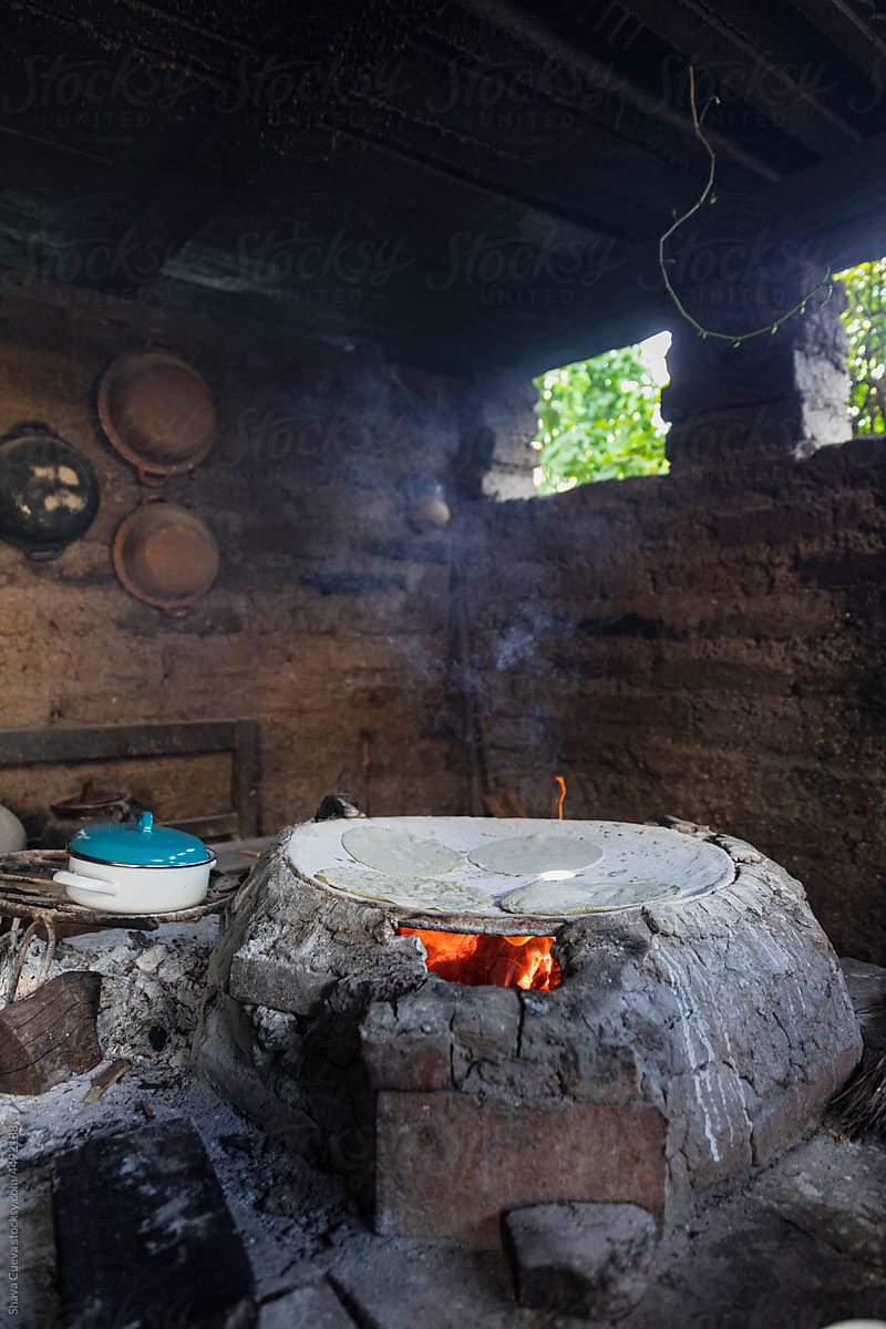 Traditional kitchen with a comal on fire