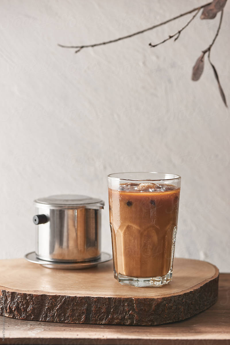 Ice coffee in glass with Vietnamese traditional coffee