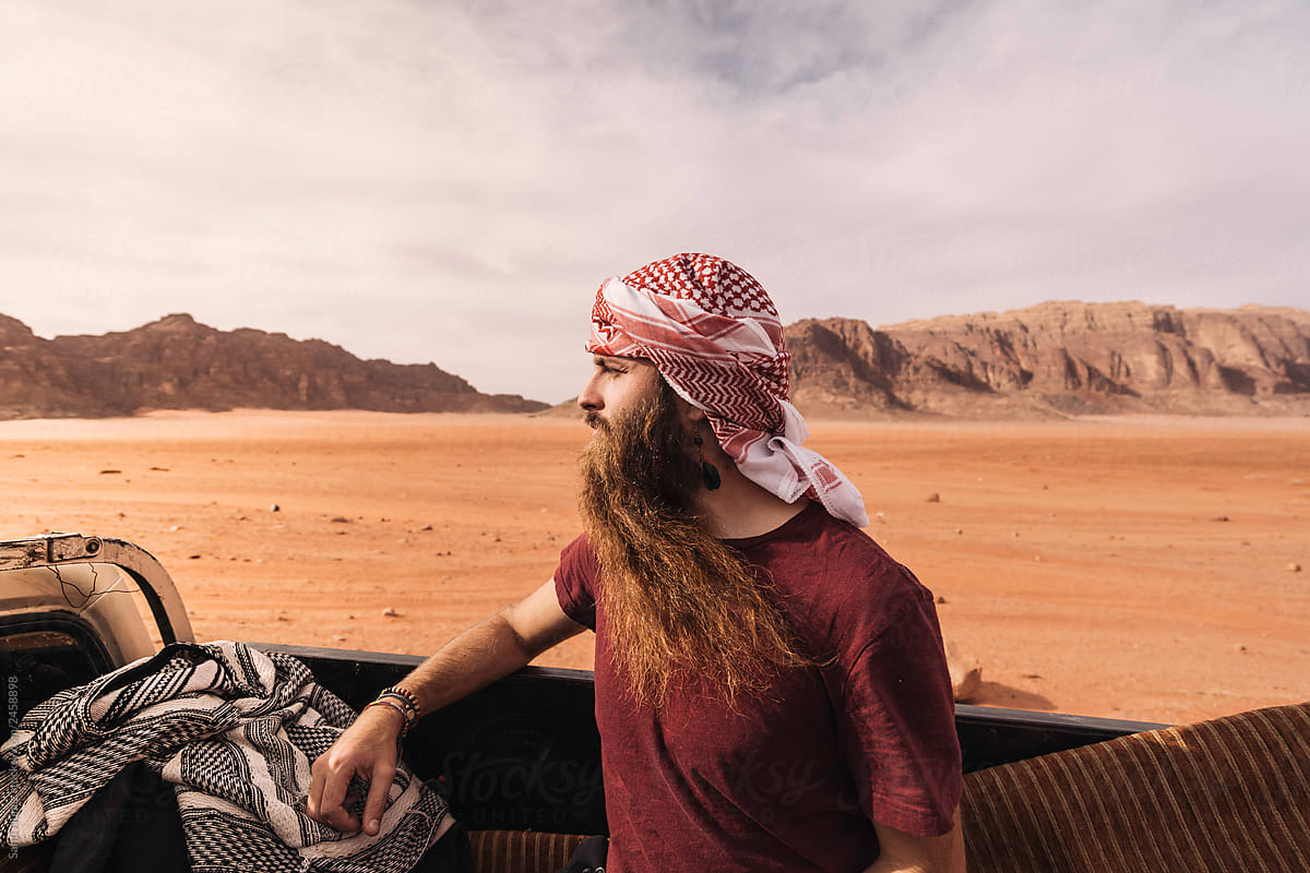 Tourist man travel into automobile In Desert