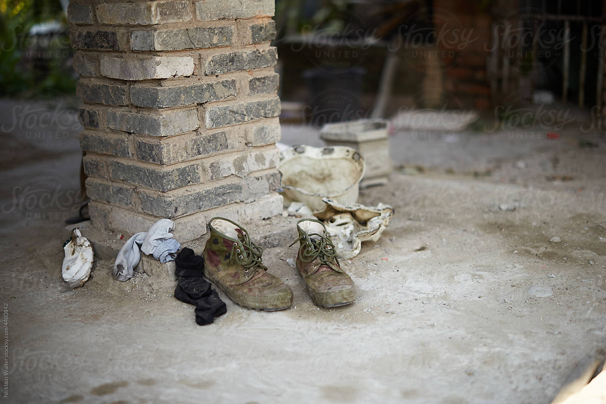 Dirty Boots And Socks Left Out To Dry In Xishuangbanna, Yunnan, China.