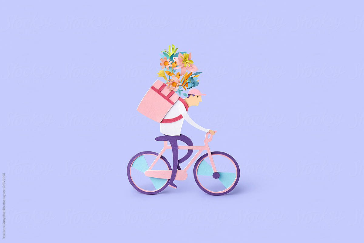 Papercraft courier delivering flowers on bike