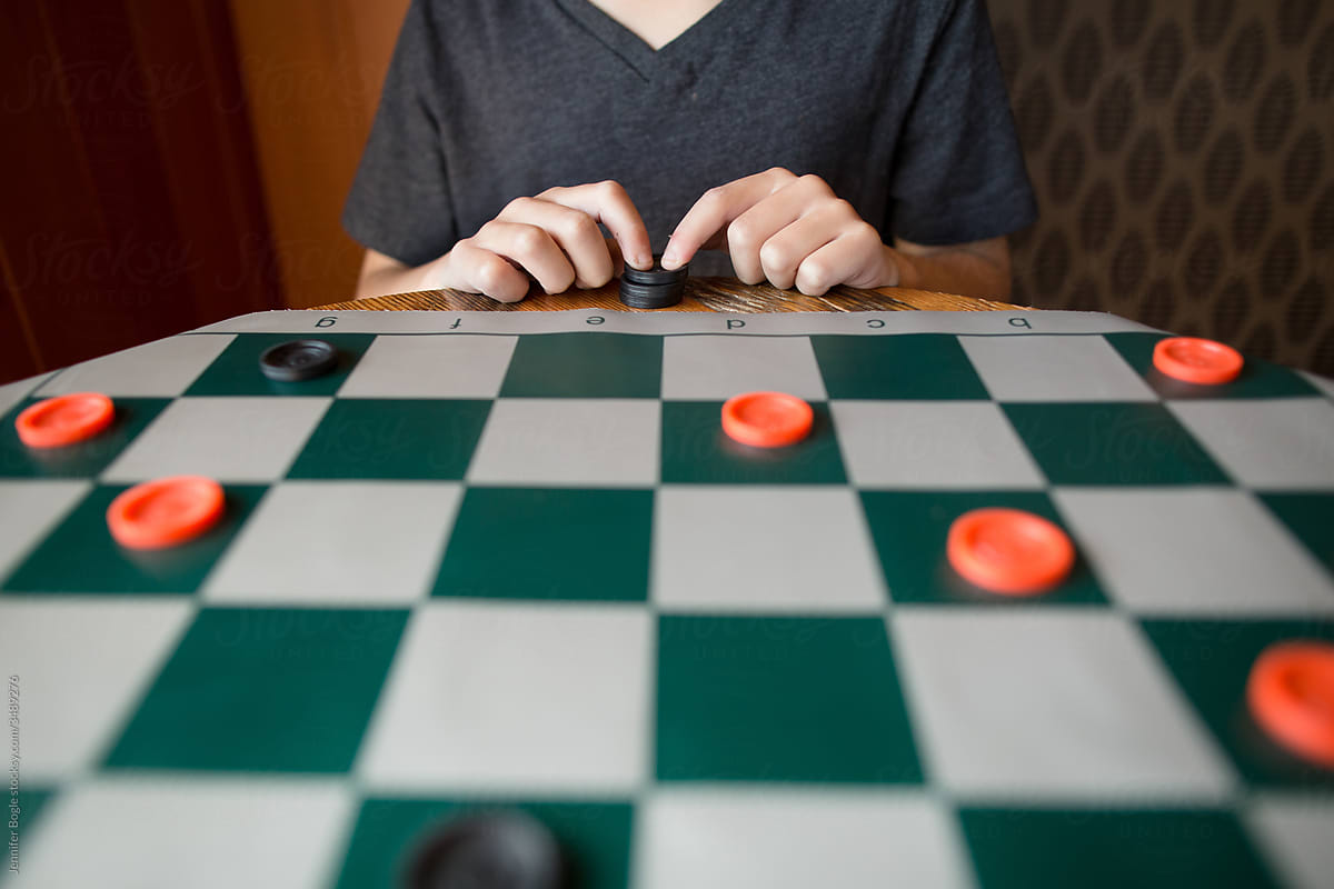 Child plays checkers