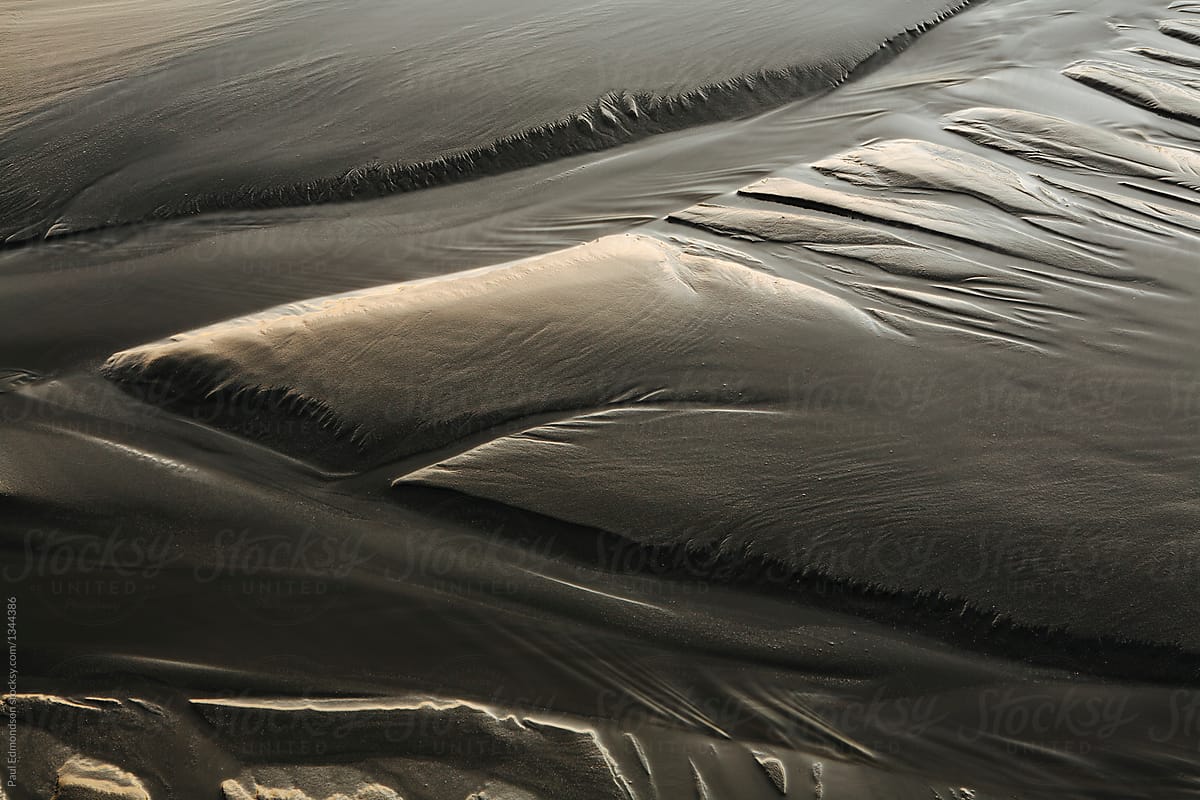 Close up of patterns in sand at low tide