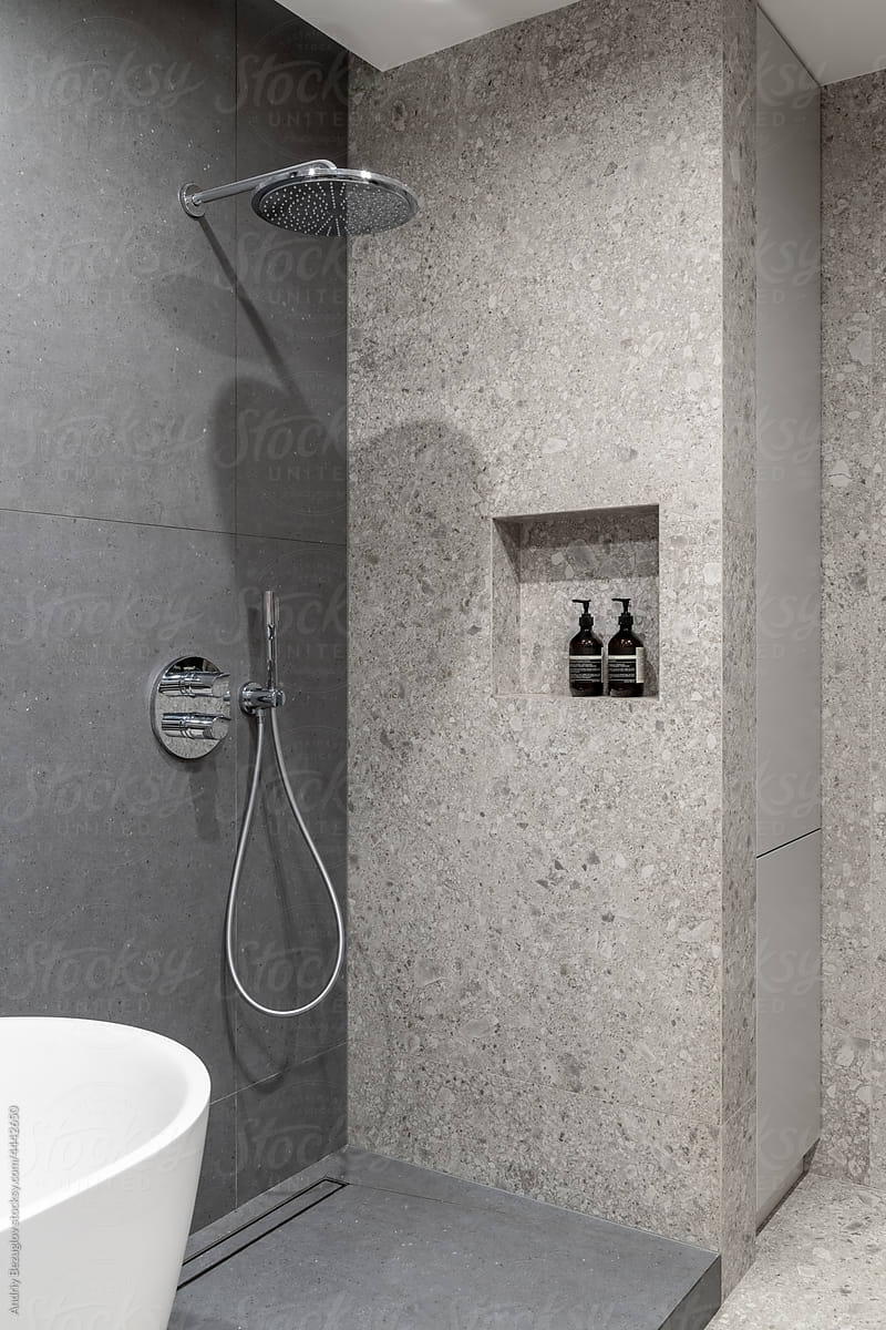 Illuminated bathroom in contemporary style with different walls