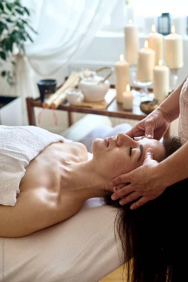 Woman receiving a relaxing head massage
