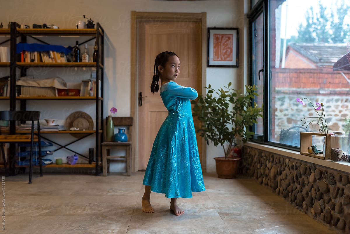 Young girl dancing at home